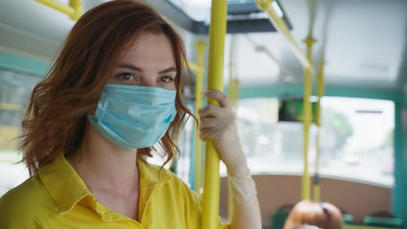 Girl in Medical Mask To Protect Against Virus and Infection Removes During Trip To City on Public