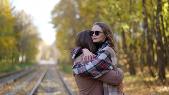 Happy Woman in Hug of Her Beloved Man Romantic Date in Autumn Park alt