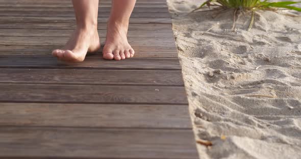 Walking Barefoot at Wooden Boardwalk alt