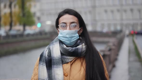 Pandemic, Portrait of a Young Middle Eastern Woman Wearing Protective Mask on Street. Covid Concept