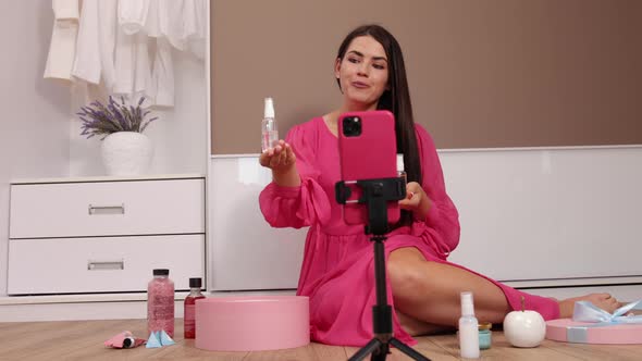 Young Female Influencer Unpacking Big Cardboard Box Sitting Mobile Phone alt