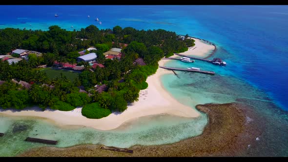 Aerial flying over panorama of exotic tourist beach adventure by transparent water with white sandy  alt