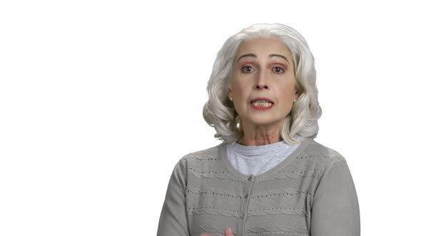 Angry Senior Woman Threatening with Fist alt