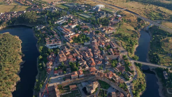 Spectacular aerial view of cityscape during sunset alt