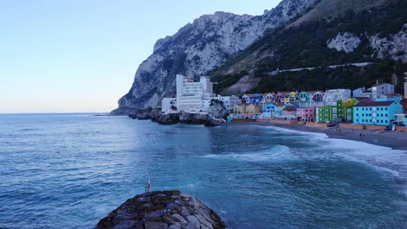 Luxury Accommodation Caleta Hotel And Colorful Buildings At Catalan Bay In Gibraltar. drone shot, pa alt