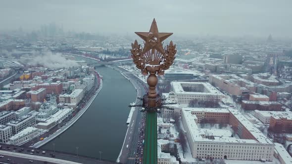 Aerial shot of the star of Stalins building - symbol of communism. On the background Moscow River alt