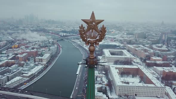 Aerial shot of the star of Stalins building - symbol of communism. On the background Moscow River