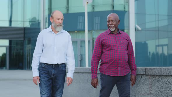 Two Diverse Employees Have a Nice Time Together Leisurely Strolls Outside Office Building During alt
