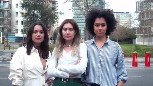 Group of Empowered Women Multiethnic Looking at Camera Showing Biceps alt