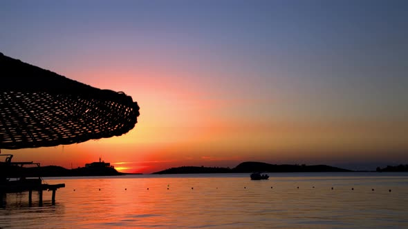 View Of Blue Heaven Water And Red Sunset alt