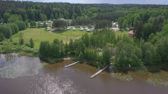 Beautiful Drone Point of View of a Caravan Park Next to a Lake