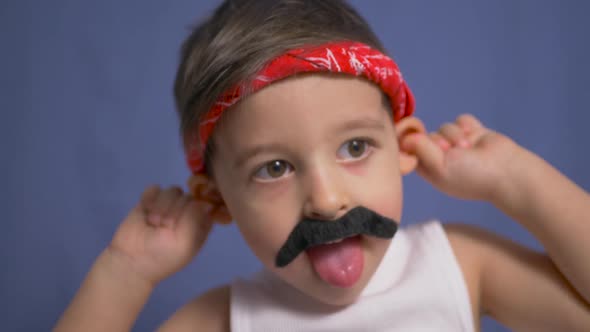 Funny Mexican Boy with a Big Black Mustache and a White t Shirt