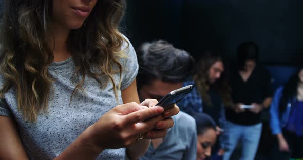 Young woman typing a message on the phone, 4K 4k alt