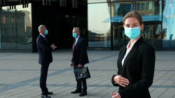 Portrait of Young Professional Business Woman Team Leader in Blue Medical Face Mask Shows Thumb Up
