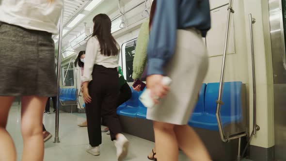 Crowd of People Wearing Face Mask on a Crowded Public Subway Train Travel alt