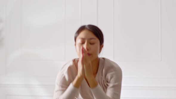 Calm of Athletic Asian woman in sportwear practice yoga Sun Salutation alt