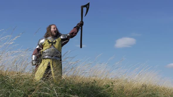 A warrior on the slope and his battle scream. Semi detail shot. Slov motion. alt