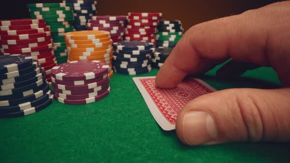 Poker Player Shows His Cards Two Aces on Poker Table