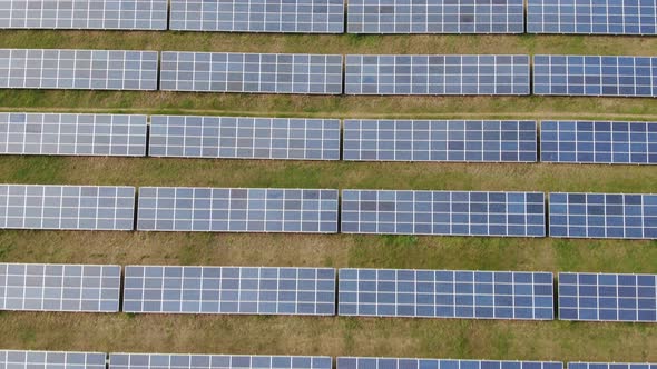 Solar Panels Quadcopter Flight Over the Field Perpendicular