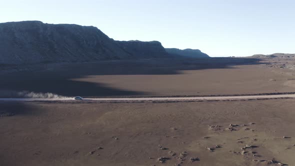 Aerial view of a vehicle driving a twisty road, Reunion. alt