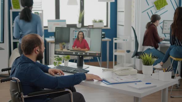 Invalid Manager Talking with Coworker During Video Conference alt