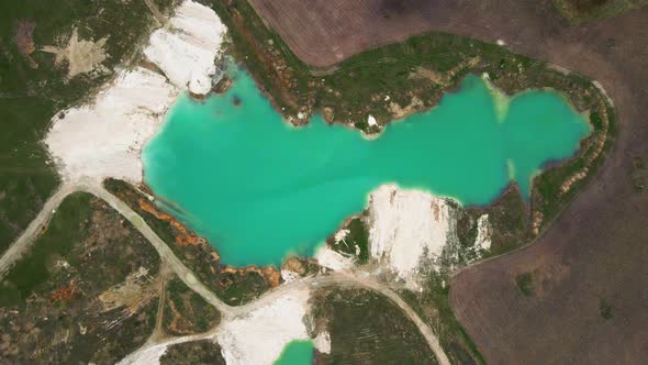 Aerial drone view Amazing industrial landscape, on Emerald lake in a flooded quarry alt