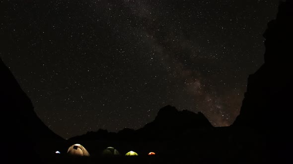 Time Lapse of Starry Sky in the Mountains. Camp Climbers Under the Starry Sky.