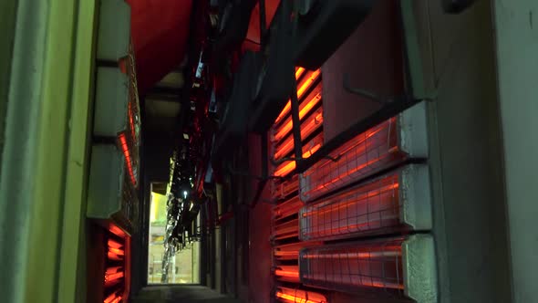 Production Workshop for Drying Painted Parts of the Oven on a Conveyor Belt alt