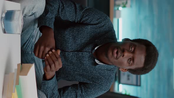 Vertical Video POV Man Greeting His Colleagues on Online Internet Video Conference Call alt