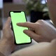 Man Swiping On Smartphone With Green Screen - VideoHive Item for Sale