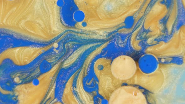 Vibrant Blue and Gold Ink Background Texture Rotating alt
