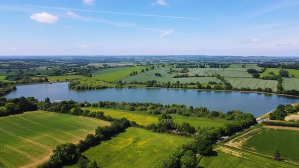 Stunning Ariel landscape of countryside with rural fields and boddington reservoir in Northamptonshi alt