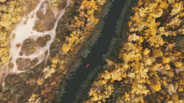 Horizontal aerial view on red kayak on Dnieper river in autumn day alt