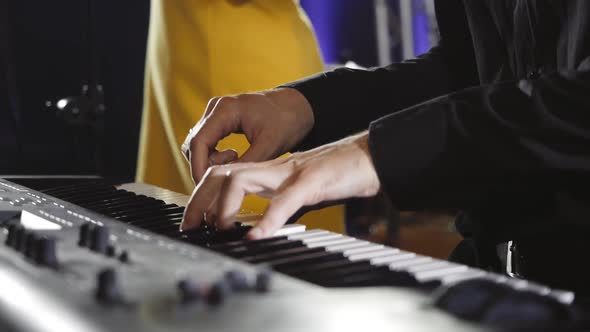 The Musician Plays the Synthesizer During the Performance