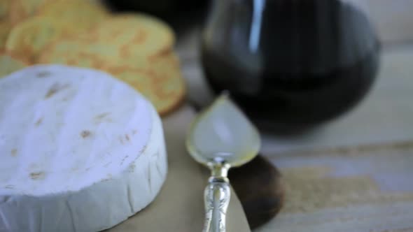 Brie cheese and cracker appetizer for  party table. alt