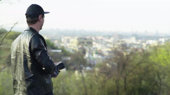 A Male Cameraman Shoots Video on an Old Vintage Camera Krasnogorsk. Kyiv. Ukraine alt