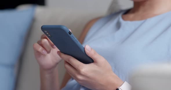 Woman Use of Mobile Phone at Home alt