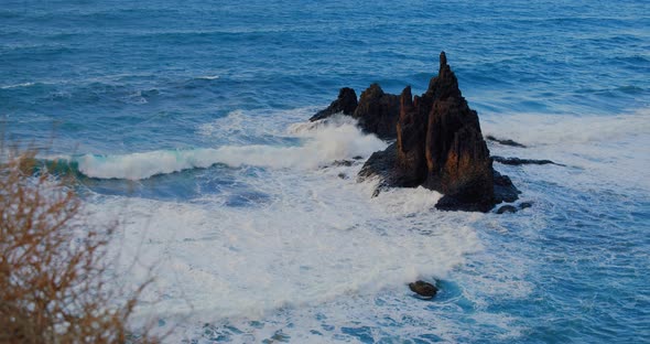 Big Waves Crash Into the Black Volcanic Rocks on the Remote Shore of Tenerife Island alt