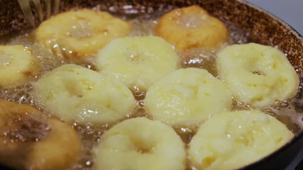 Frying Cooking Homemade Doughnuts on Hot Boiling Oil Fat Junk Food Preparation alt