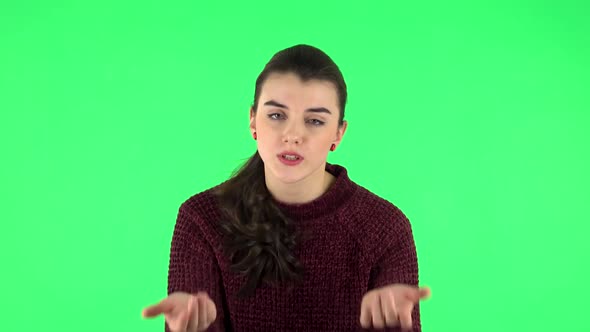 Girl Is Upset, Waving Her Hands in Indignation, Shrugs. Green Screen alt
