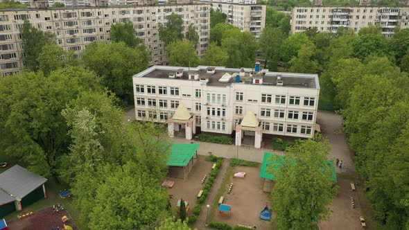 Kindergarten in the Midst of a Green Landscape Aerial View