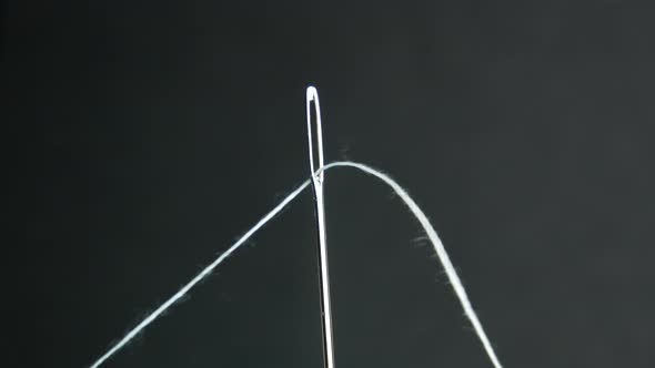 Close Up Needle With White Thread, Preparation For Sewing. Stop Motion alt