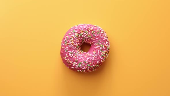 Top View Colorful Sweet Ring Donut with Pink Glaze Bright Pastry Topping alt