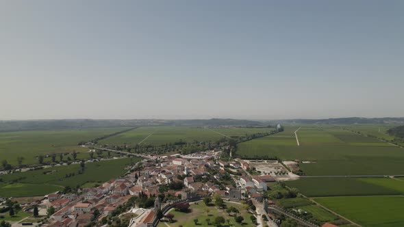 Historic Montemor-o-Velho castle on hilltop, Portugal; drone dolly out