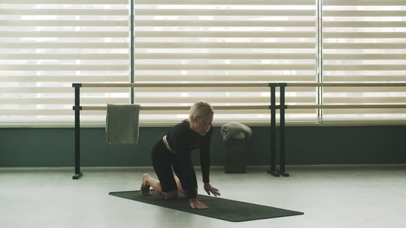 Woman Ptactice Yoga Indoors Alone Doing Exercises Asanas alt