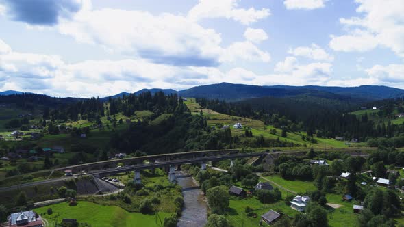 The Viaduct in Vorokhta is a Railway Stone Arch Bridge Across the Prut River Aerial View alt