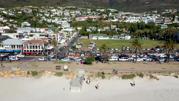 Cruising past the main street in Camps Bay showcasing beach front attractions