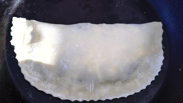 Adult Woman Making Chebureks Roasts Chebureks in Pan Prepares Meat Pies Working with the Dough and alt