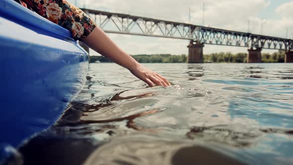 Hands Playing And Touching Water In Slow Motion. Woman Having Fun On Holiday Vacation Weekend Trip. alt