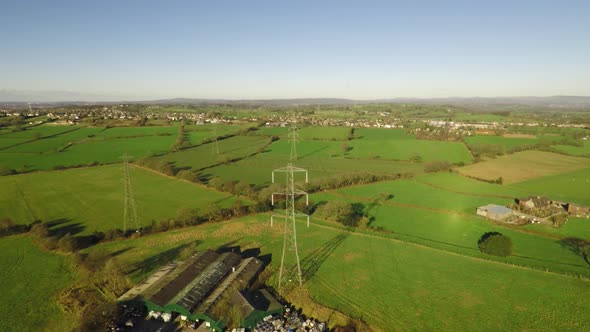 Aerial footage of  high voltage electricity towers and power lines in the beautiful Staffordshire co alt